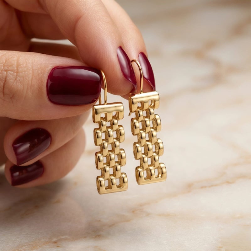 Long gold earrings featuring movable charms that sway with your movement, creating a captivating sparkle. A luxurious and modern piece that will turn heads. - Image 4